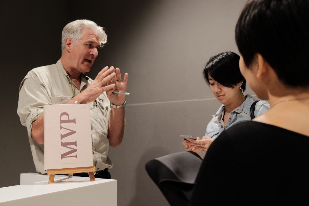 Gary Knight speaks with audience members after his public lecture.