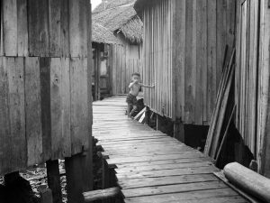 Time and Tide by Foo Tee Jun - Kampung in Geylang, c. 1960s