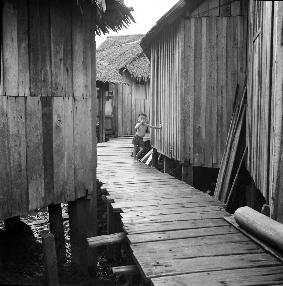 Time and Tide by Foo Tee Jun - Kampung in Geylang, c. 1960s