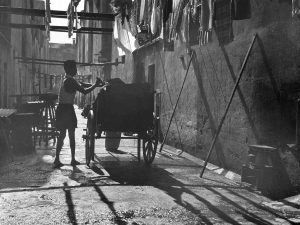 Time and Tide by Foo Tee Jun - Garbage collector at back alley, c. 1960s