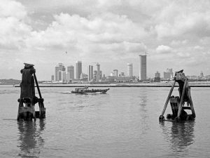 Time and Tide by Foo Tee Jun - View of city skyline from sea, c. 1970s