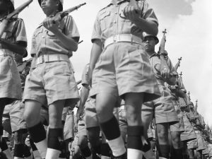 Time and Tide by Foo Tee Jun - Police officers march during National Day Parade, 1967