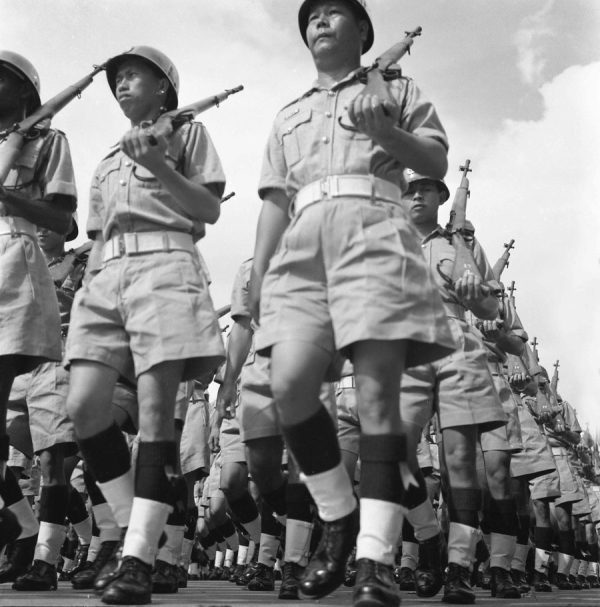 Time and Tide by Foo Tee Jun - Police officers march during National Day Parade, 1967