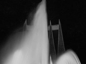 Time and Tide by Foo Tee Jun - Men silhouetted against fountain at National Theatre, c. 1960s
