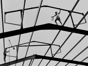 Time and Tide by Foo Tee Jun - Labourers construct a roof, c. 1960s