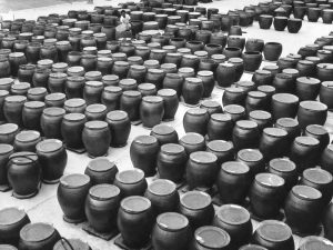 Time and Tide by Foo Tee Jun - Worker at Tai Hua Soy Sauce factory, c. 1960s