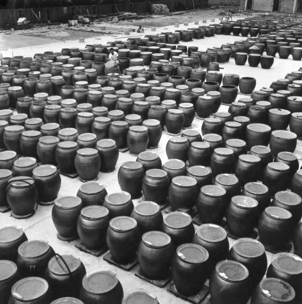 Time and Tide by Foo Tee Jun - Worker at Tai Hua Soy Sauce factory, c. 1960s