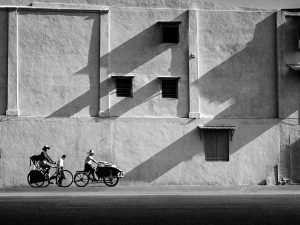 Time and Tide by Foo Tee Jun - Trishaw and bicycle outside Fu An Shopping Centre, c. 1960s