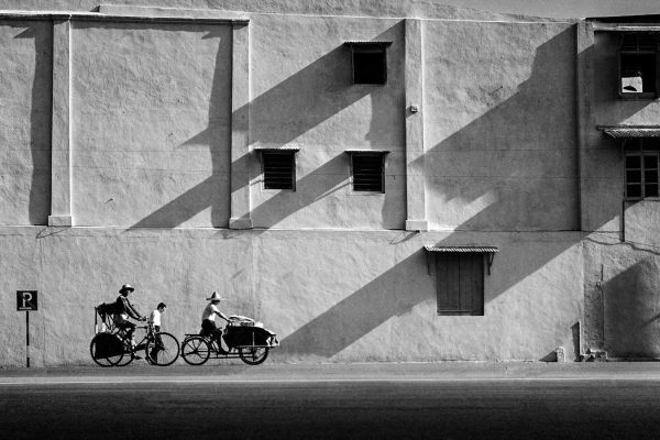 Time and Tide by Foo Tee Jun - Trishaw and bicycle outside Fu An Shopping Centre, c. 1960s