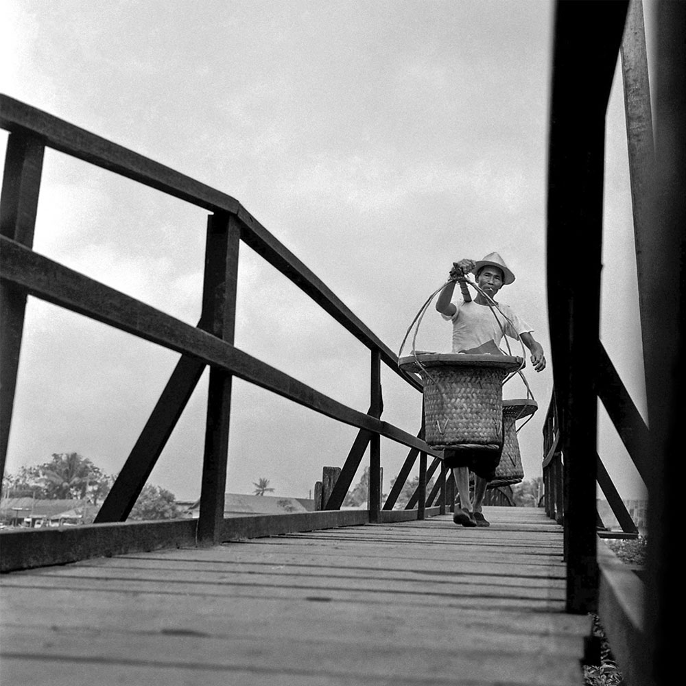 Passing Time by Lui Hock Seng - Man crossing bridge, Potong Pasir, c. 1960s – 1970s