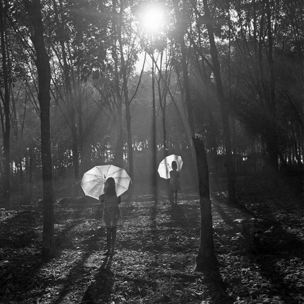 Passing Time by Lui Hock Seng - Girls posing at rubber plantation, Bukit Panjang, c. 1960s – 1970s