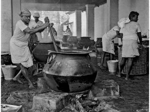 Passing Time by Lui Hock Seng - Man cooking for Temple devotees, Tank Road c. 1960s – 1970s